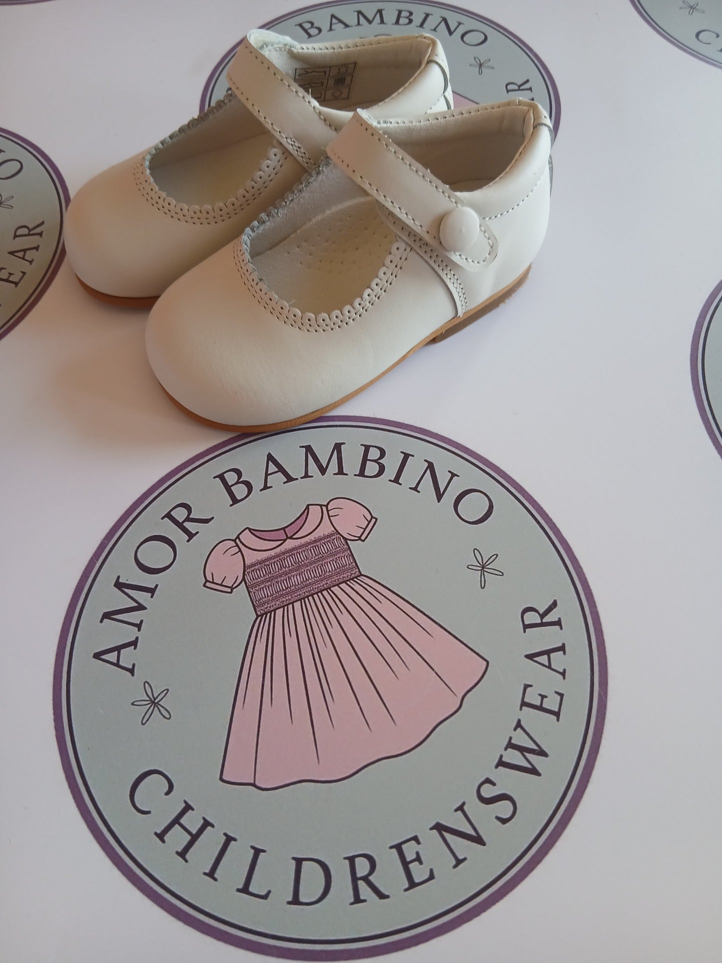 Girls cream button matte mary jane shoes on Amor Bambino childrenswear