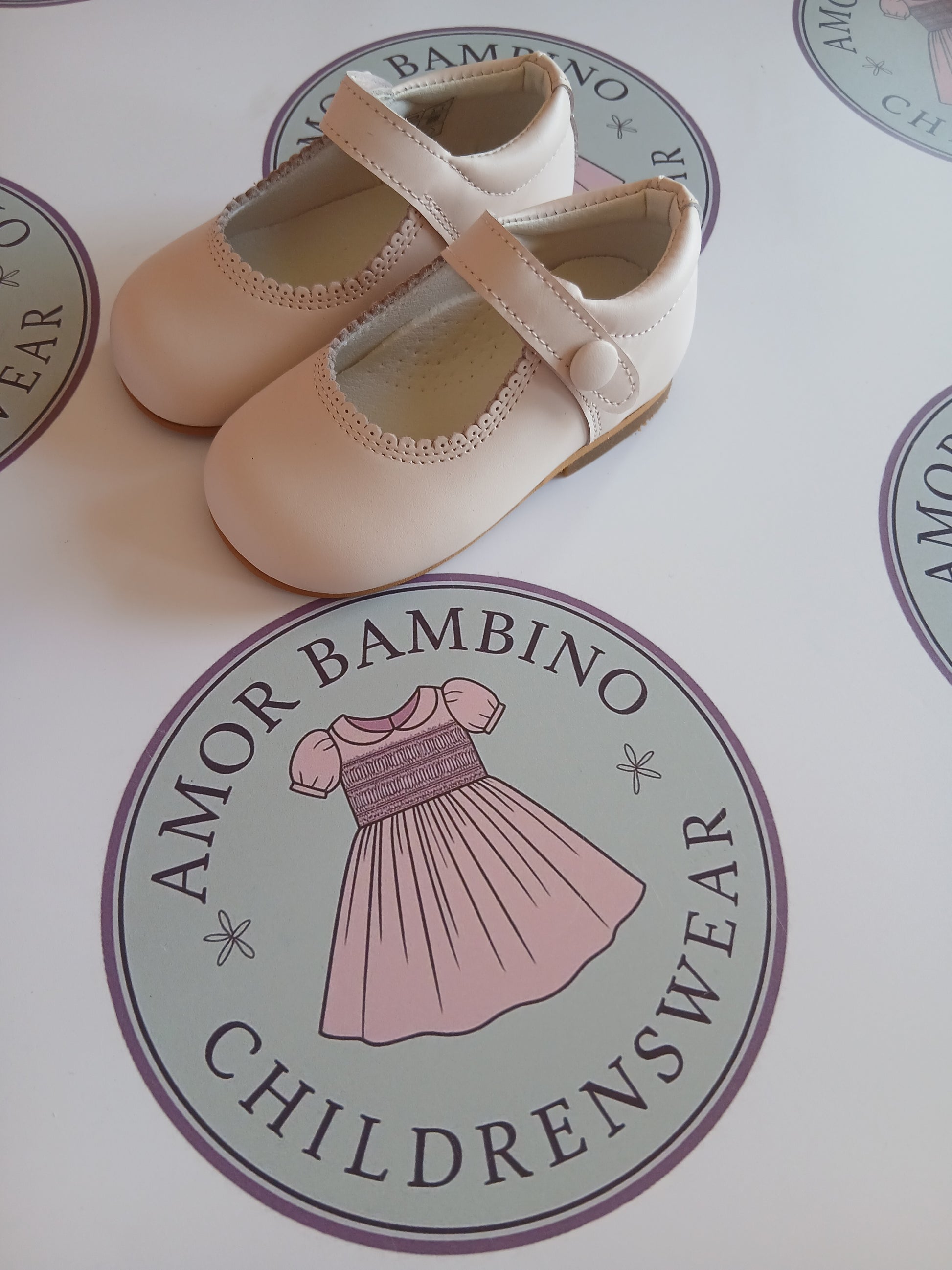 Girls Pink button matte shoes on amor Bambino childrenswear brand logo
