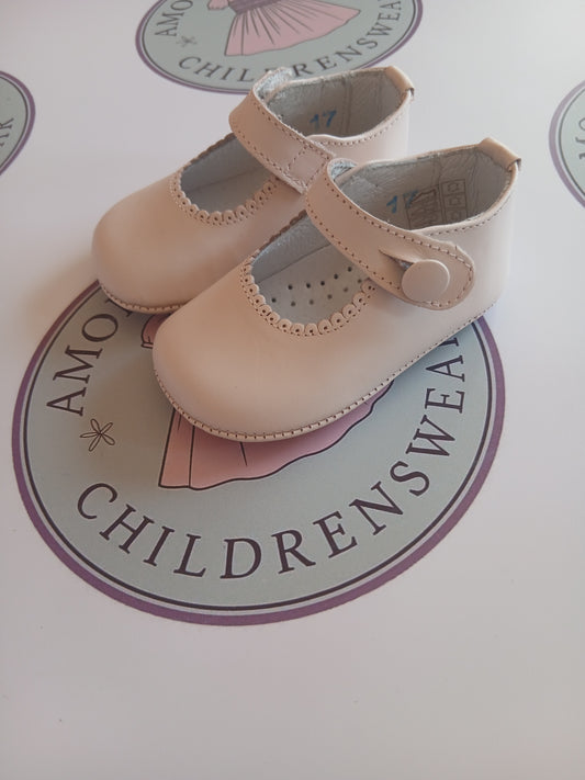 Girls baby pink button mary jane pram shoes on Amor Bambino childrenswear brand logo.
