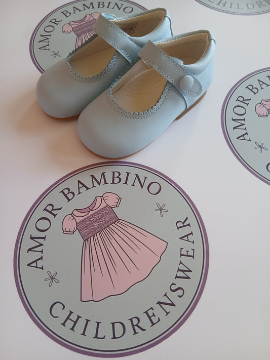 Girls baby blue button matte mary jane shoes on amor Bambino childrenswear brand logo